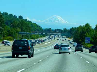 See Mount Rainier from a US HIghway in Seattle