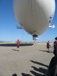 Passengers ride in that little gondola under the airship