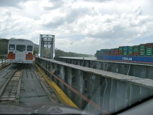 On the one-lane bridge into Gamboa... cars, trains and Panamax container ships travel side by side. On the one-lane bridge into Gamboa... cars, trains and Panamax container ships travel side by side.